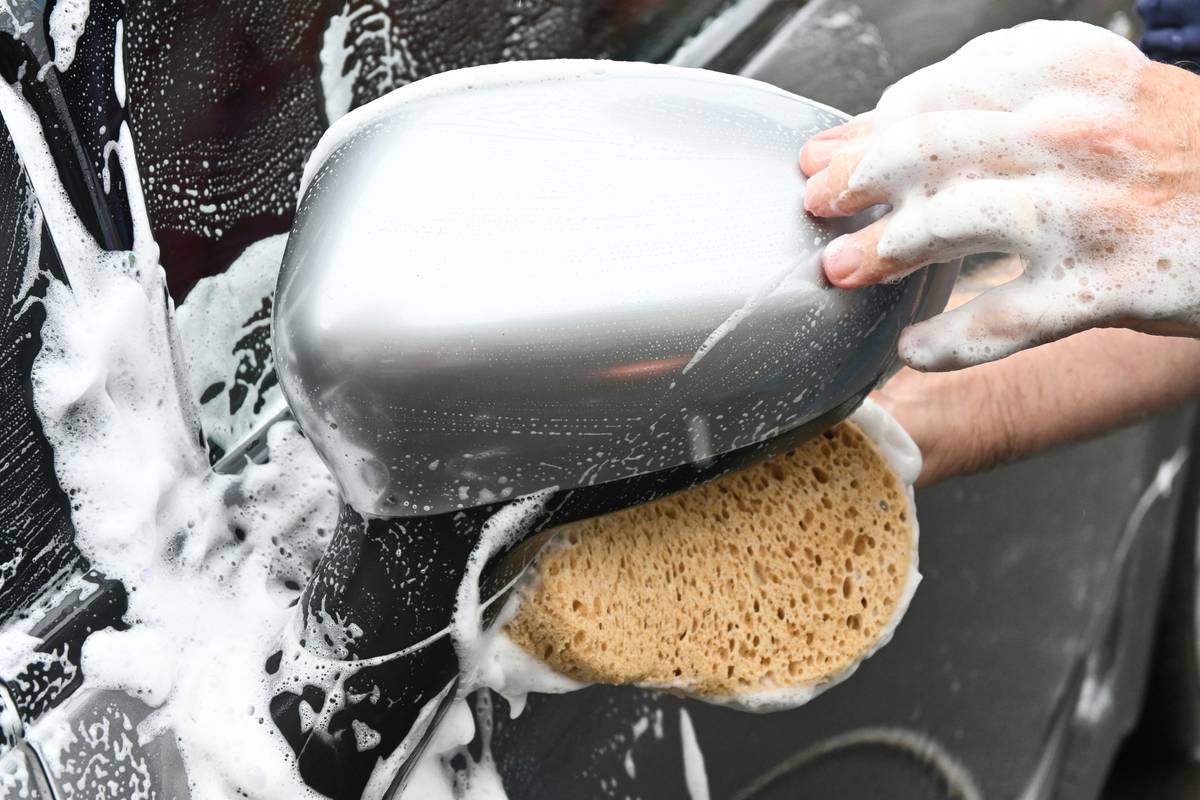 how to clean crock pot stoneware showing stained beige ceramic insert beside clean white one with baking soda paste and soft brush
